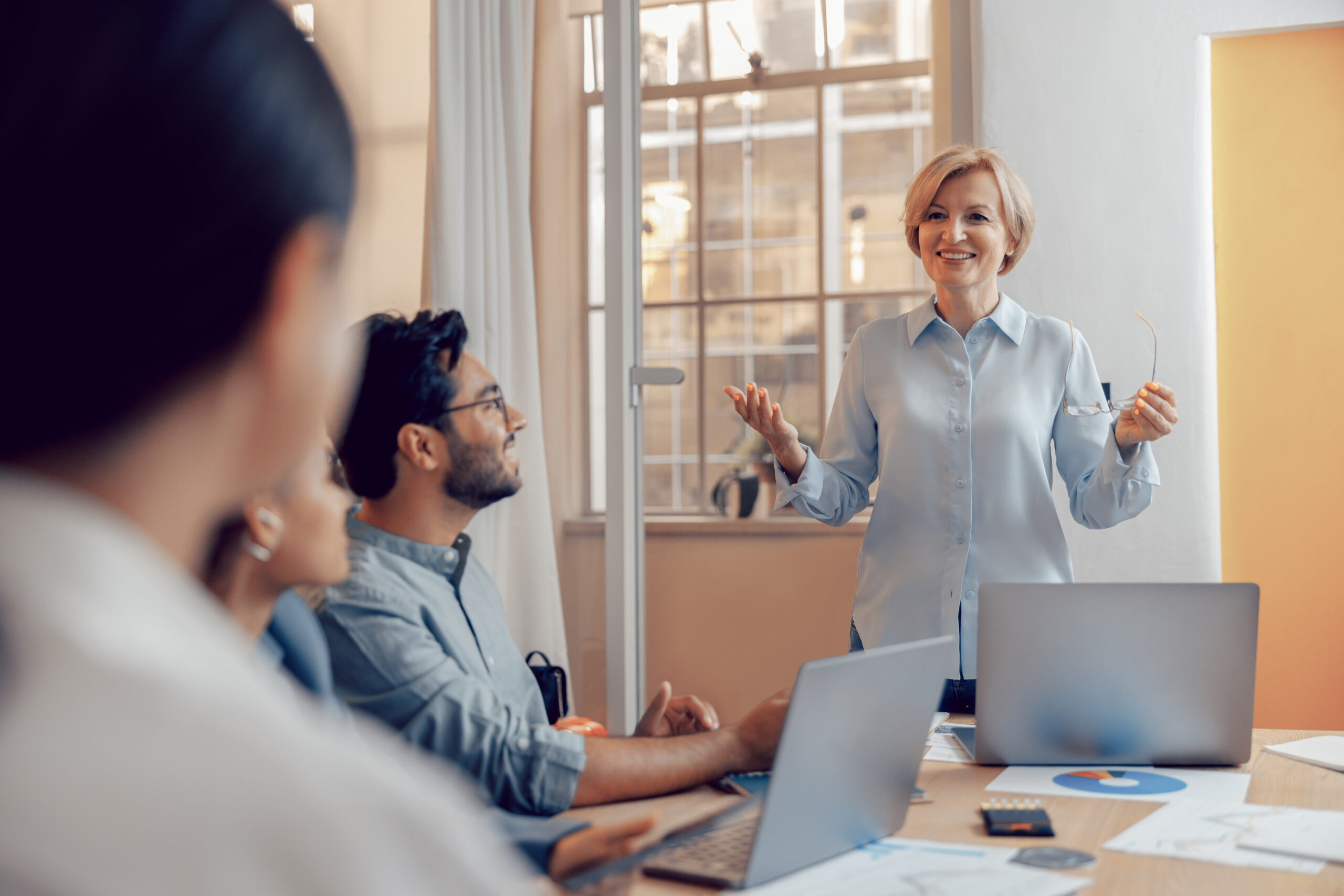 Team of business investors is discussing a new project in modern office. Concept of financing